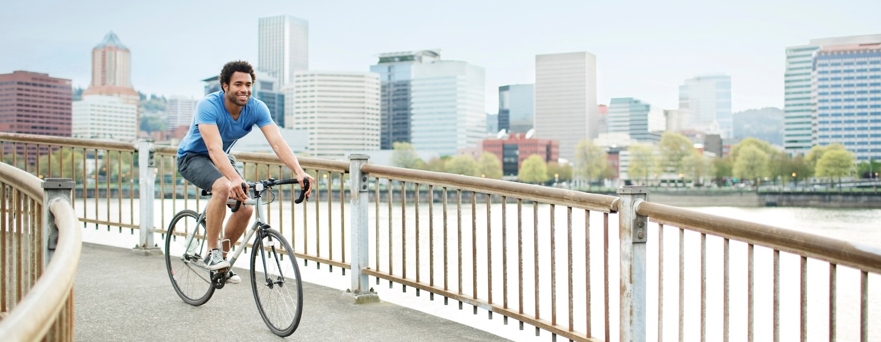a person riding a bicycle on a bridge